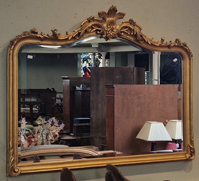 Lot 663 - An antique gilt overmantle mirror with...