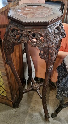 Lot 741 - A Chinese darkwood octagonal shaped urn stand,...