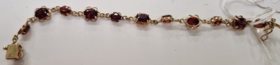 Lot 40F - A 9ct gold and garnet set bracelet, 18cm long,...
