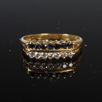 Lot 208J - A yellow metal, sapphire and diamond double...