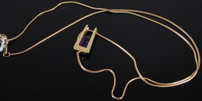 Lot 210H - A 9ct gold necklace suspending a 9ct gold and...