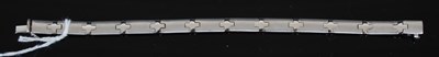 Lot 210P - A 9ct white gold rectangular link bracelet, 13....
