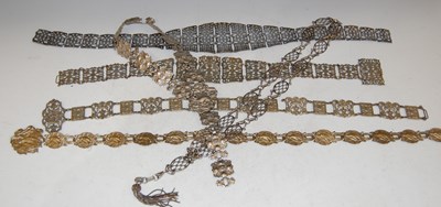 Lot 186 - A box of assorted white metal belts with...