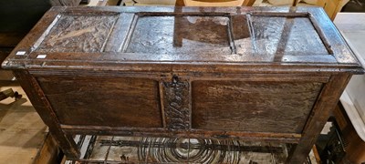 Lot 857 - An Antique oak coffer with carved floral...