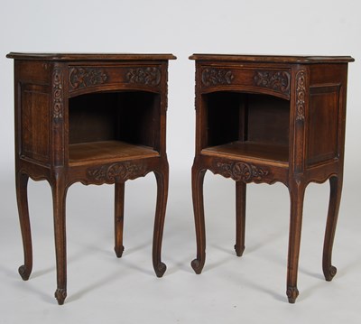 Lot 85 - A pair of French style oak bedside...