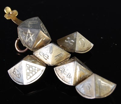 Lot 42 - A yellow metal Masonic orb-shaped metamorphic...