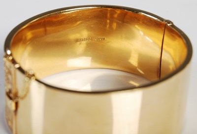 Lot 47 - An 18ct gold hinged bangle, one half with...