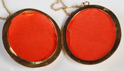 Lot 54 - A 9ct gold oval-shaped locket suspended on...
