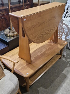Lot 755 - A blonde wood rectangular coffee table,...