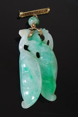 Lot 37 - A Chinese yellow and white metal mounted jade...