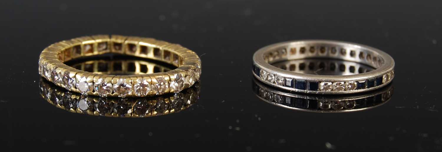 Lot 43 - Two eternity rings to include a yellow metal...