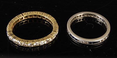 Lot 43 - Two eternity rings to include a yellow metal...