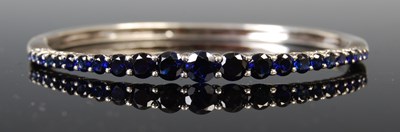 Lot 43 - A white metal and synthetic sapphire single...