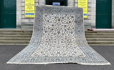 Lot 764 - A large Persian ivory ground carpet, 20th...
