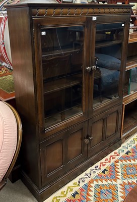 Lot 678 - A 20th century stained oak bookcase, fitted...