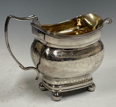 Lot 506 - A George III silver helmet-shaped cream jug,...