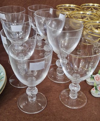 Lot 18 - A set of eight (6+2) Lalique clear glass wine...