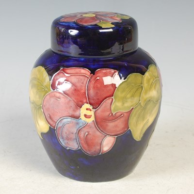 Lot 22 - Clematis, a Moorcroft blue ground jar and...