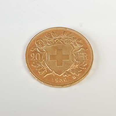 Lot 329 - A Swiss gold 20 Franc coin, dated 1980.