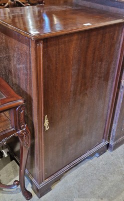 Lot 934 - A mahogany cupboard opening to fitted interior...