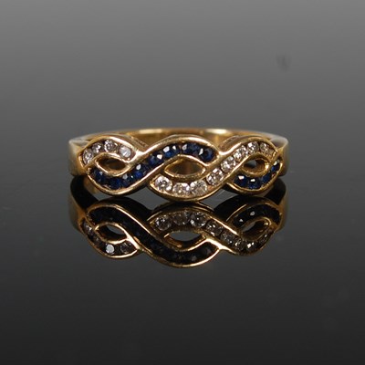 Lot 38 - An 18ct gold, sapphire and diamond dress ring,...