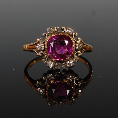 Lot 560 - A yellow metal, red to pink corundum and...
