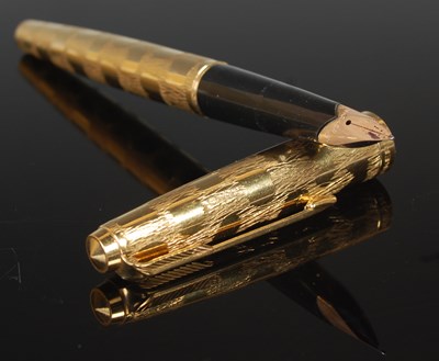 Lot 93 - A vintage yellow metal Parker fountain pen,...