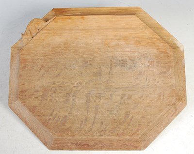 Lot 102 - A Mouseman oak octagonal shaped chopping board,...