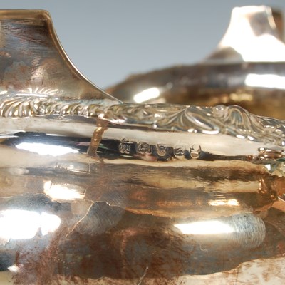 Lot 121 - An antique three piece London silver tea set,...