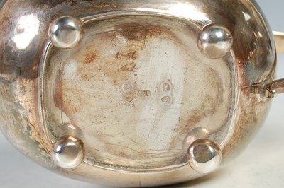 Lot 121 - An antique three piece London silver tea set,...