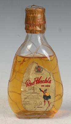 Lot 181 - A vintage bottle of Red Hackle Deluxe scotch...
