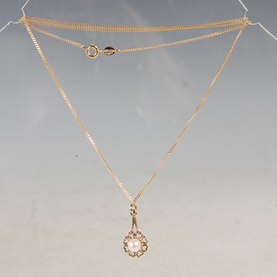 Lot 202 - A 9ct gold necklace suspending yellow metal...