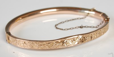 Lot 603 - A 9ct gold hinged bangle, gross weight 6.6 grams.