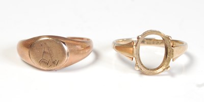 Lot 265 - A yellow metal ring, lacking stone, stamped...