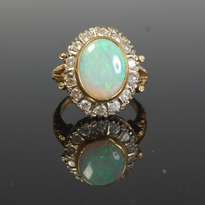 Lot 289 - An 18ct gold, opal and diamond cluster ring,...