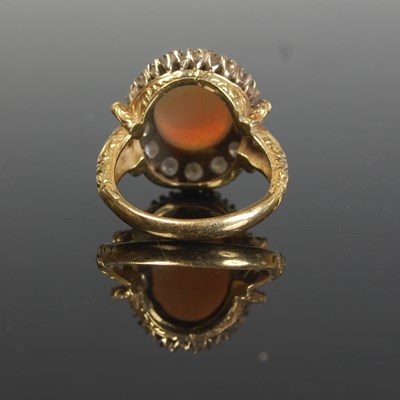 Lot 289 - An 18ct gold, opal and diamond cluster ring,...