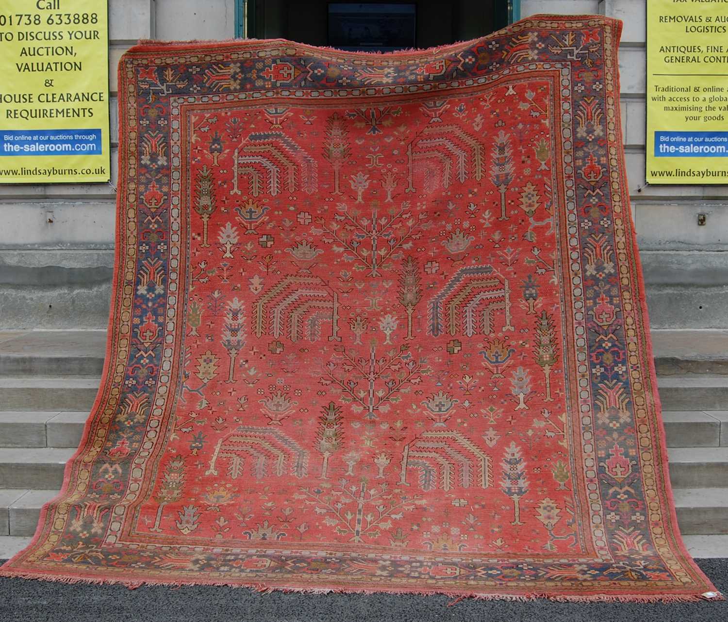 Lot 803 - A late 19th/ early 20th century madder ground...
