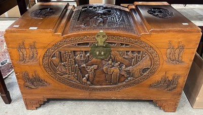 Lot 737 - A Chinese camphor wood box carved in shallow...