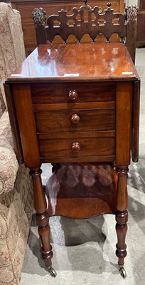 Lot 749 - A late 19th century mahogany drop-leaf bedside...