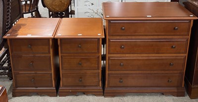 Lot 754 - A modern wood effect chest of four long...