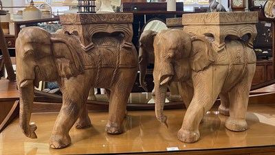 Lot 783 - A pair of carved wood elephant stands, 47cm...
