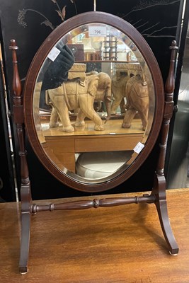 Lot 796 - A mahogany and boxwood strung oval bevelled...