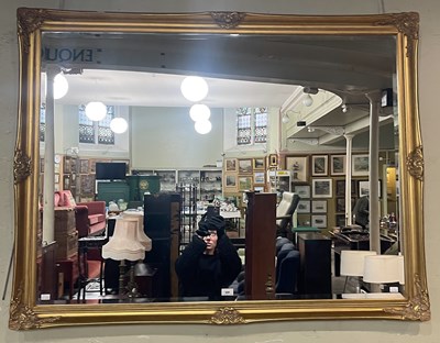 Lot 808 - A gilt framed rectangular bevelled overmantle...