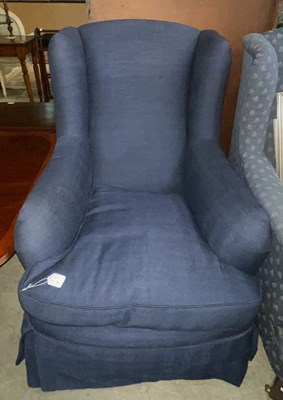 Lot 816 - A mahogany wing armchair with loose cushion...