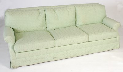 Lot 12 - A green upholstered three seat sofa with loose...