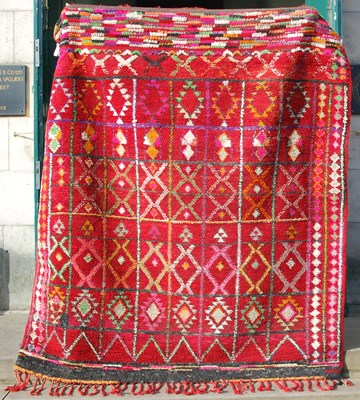 Lot 845 - A 20th century Persian madder ground carpet,...