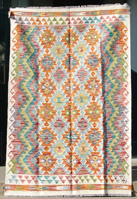 Lot 846 - A Chobi Kilim rug, the ivory ground worked in...