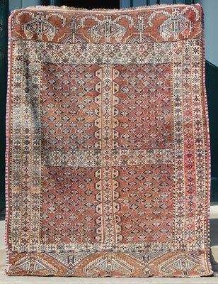 Lot 861 - A Baluchi rug, the madder ground divided into...