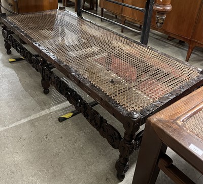 Lot 760 - A 19th century carved oak day bed, the...