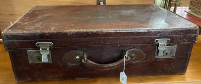 Lot 770 - A vintage brown leather suitcase, 66cm wide.